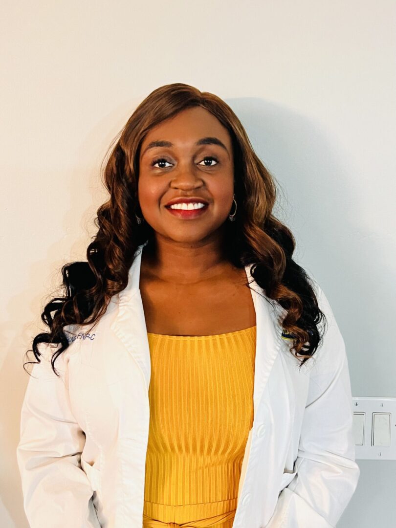 A woman in a yellow top and white jacket